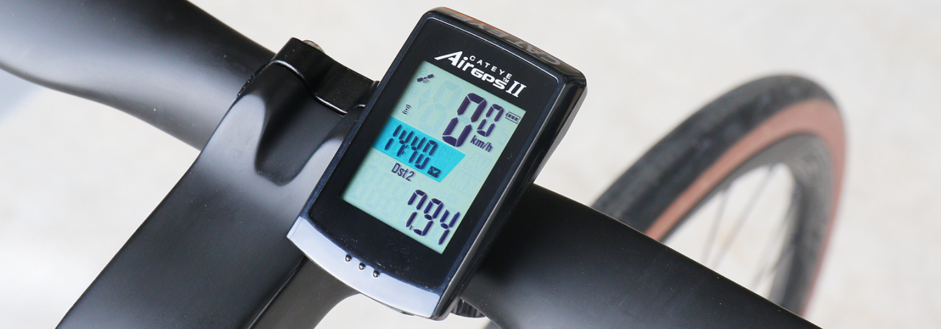 Cycling computer with 2.5" color touchscreen displaying live power, gradient, and mapped route on road bike