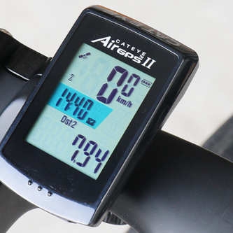 Cycling computer with 2.5" color touchscreen displaying live power, gradient, and mapped route on road bike