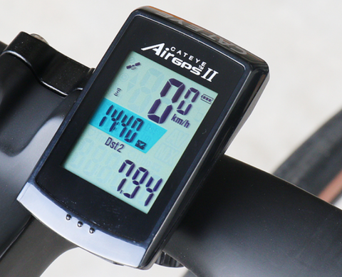 Cycling computer with 2.5" color touchscreen displaying live power, gradient, and mapped route on road bike