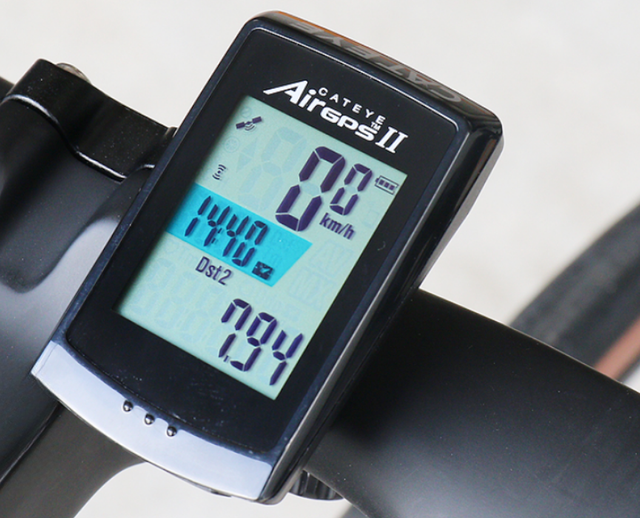 Cycling computer with 2.5" color touchscreen displaying live power, gradient, and mapped route on road bike