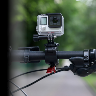 Cycling camera with rotating handlebar mount capturing 170° wide-angle commuter rides in day/night mode