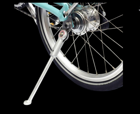 Bolt-on kickstand mount at chainstay dropout with tension spring mechanism for automatic retraction