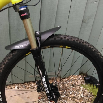 Quick-detach polycarbonate fenders with rubberized mounts clearing 45mm gravel tires for mixed-surface riding