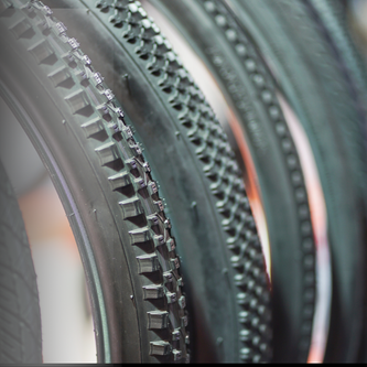 	40mm tubeless gravel tire with reinforced sidewalls and embedded sealant particles for puncture protection