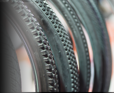 	40mm tubeless gravel tire with reinforced sidewalls and embedded sealant particles for puncture protection