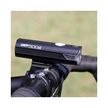 The AMPP500s front bike light mounted on a handlebar, providing consistent LED illumination for enhanced safety during night-time rides.