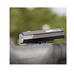 Close-up of the AMPP800 bike light attached to a handlebar, highlighting its robust build and advanced LED technology for optimal brightness.