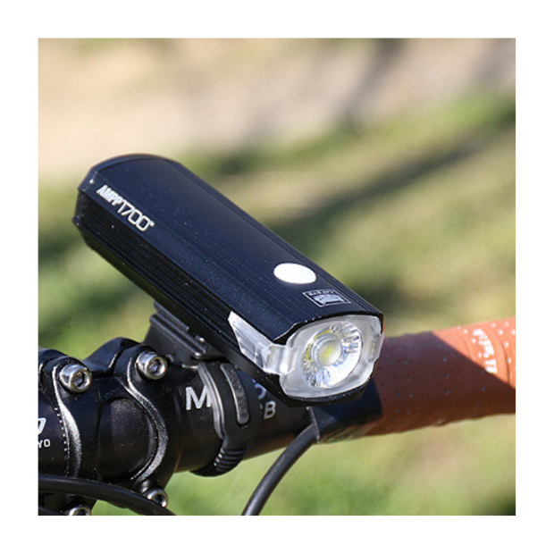 Cateye AMPP 2200 front bike light on a handlebar with clear LED light