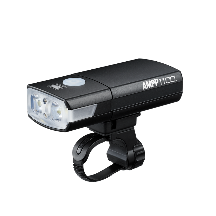 Cateye AMPP1100 bike light mounted on a handlebar, featuring high-performance LED lights for safe and bright cycling.