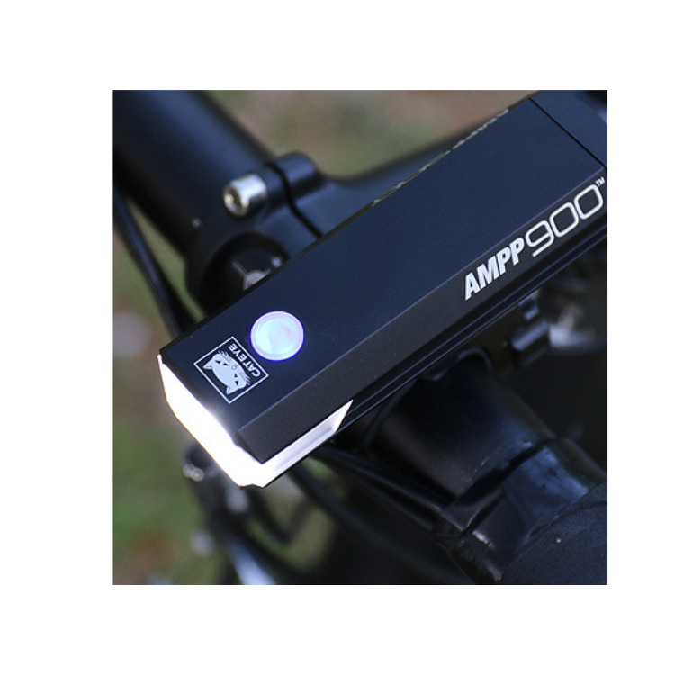 Cateye AMPP900 front LED light mounted on a bike, perfect for nighttime riding visibility.