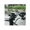 Cateye AMPP 100 headlight mounted on the front handlebars of a bike, designed for optimal illumination during cycling in low-light conditions.