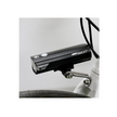 Cateye AMPP 2200 front bike light mounted on a bicycle, providing powerful LED illumination to enhance night-time visibility for cyclists.