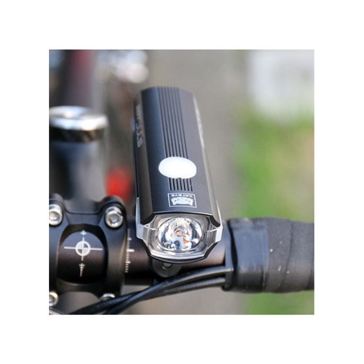 Close-up view of the Cateye AMPP 500S front light, highlighting its advanced design and bright beam for enhanced cycling safety.