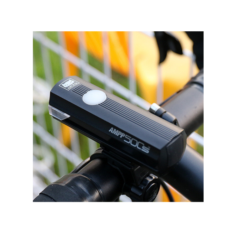 Cateye AMPP 500S front light mounted securely on the handlebars of a bicycle, offering bright and reliable visibility for safe cycling.