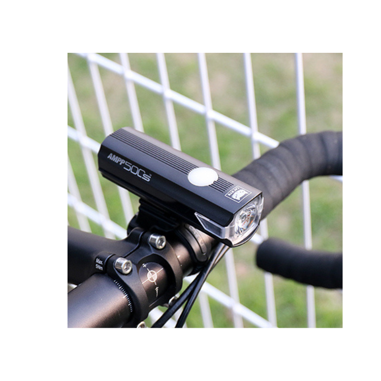 Cateye AMPP 500S front light securely mounted on the handlebars, delivering powerful illumination for enhanced safety while cycling at night.