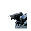 Cateye AMPP 900 front bike light mounted securely on a helmet, designed for powerful illumination and maximum visibility during night cycling.