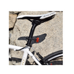 Cateye rear LED bike light mounted on the seat post with clear visibility, providing enhanced cycling safety with bright red illumination.