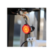 Cateye rear LED bike light mounted on a bike seat post, offering bright red light for enhanced visibility and safety during cycling.
