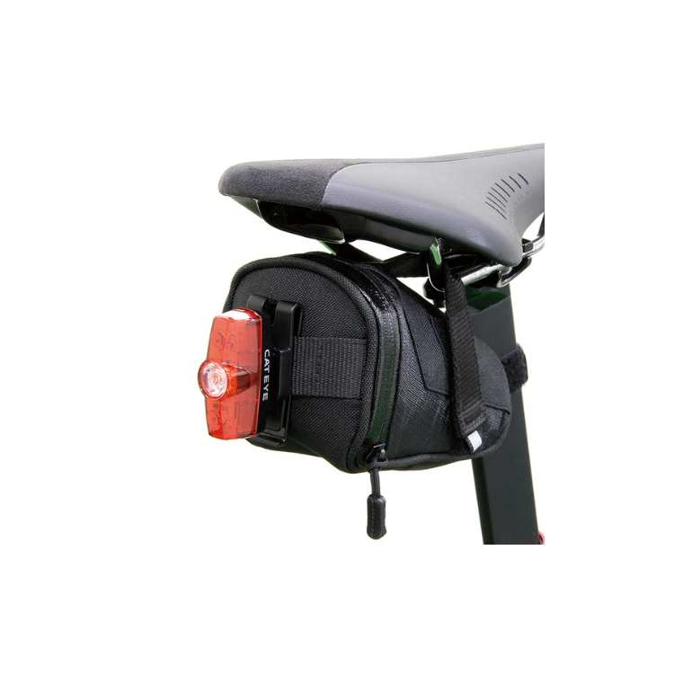 Cateye rear light attached to a saddle bag, mounted on the seat post for enhanced visibility and safety during cycling.