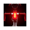 Cateye Tight Kinetic front bike light mounted on handlebars, featuring bright red LEDs for optimal visibility in low-light conditions.