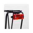Cateye Tight Kinetic rear light mounted on a bike rack, demonstrating its easy attachment and bright red light for increased cyclist visibility.