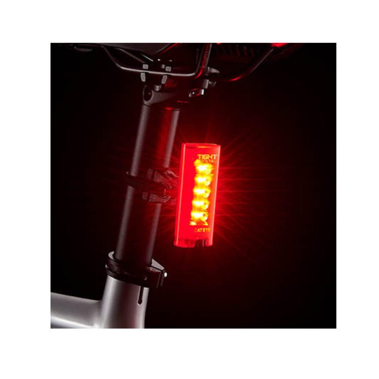 Cateye Tight Kinetic rear light with five bright red LEDs, mounted on a bike seat post, providing optimal visibility for cyclists in low light.