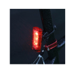 Cateye Tight Kinetic rear light mounted on a bike, showing its bright red light while exposed to rain, highlighting its water-resistant feature for all-weather cycling.