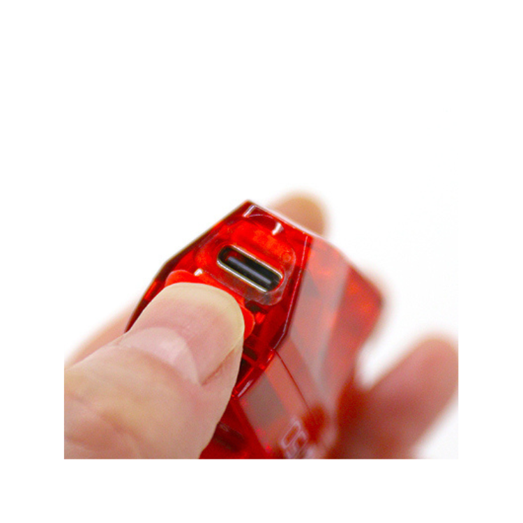 Close-up of USB-C charging port on Cateye VIZ150 red rear bike light.