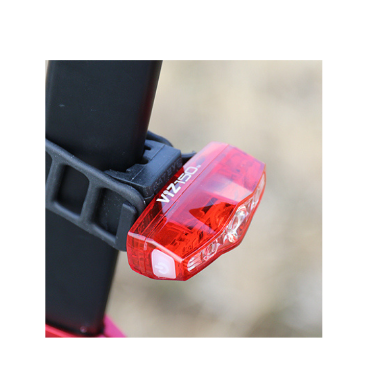 Cateye VIZ 150 rear bike light mounted on a bike's seat post, offering compact design and bright illumination for added safety during night rides.