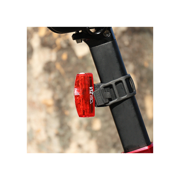 Cateye VIZ 150 rear light attached to a bicycle seat post, offering optimal visibility with a sleek red design, ensuring enhanced safety during low-light cycling conditions.