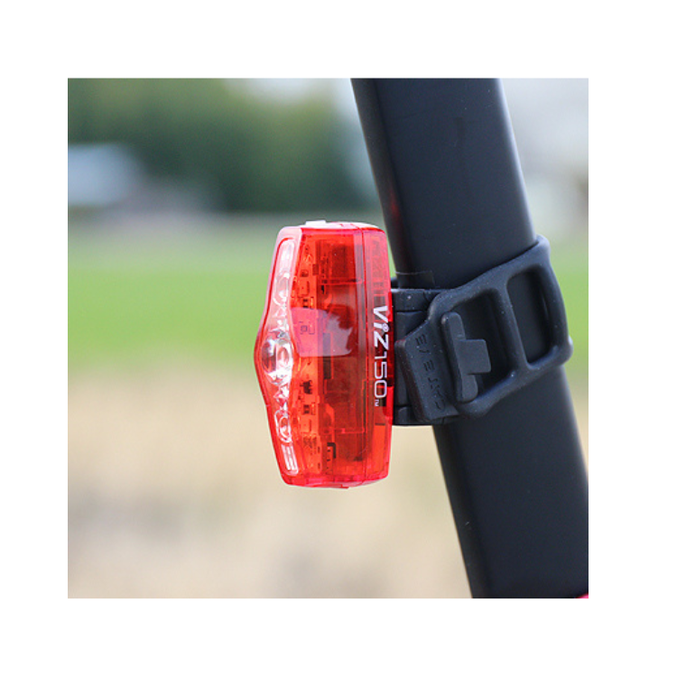 Cateye VIZ 150 red rear light mounted on a bike's seat post, providing excellent visibility with a compact and durable design for safer night cycling.