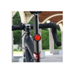 Cateye wearable mini LED light mounted on the bike seat post, providing bright red illumination for increased visibility during cycling.