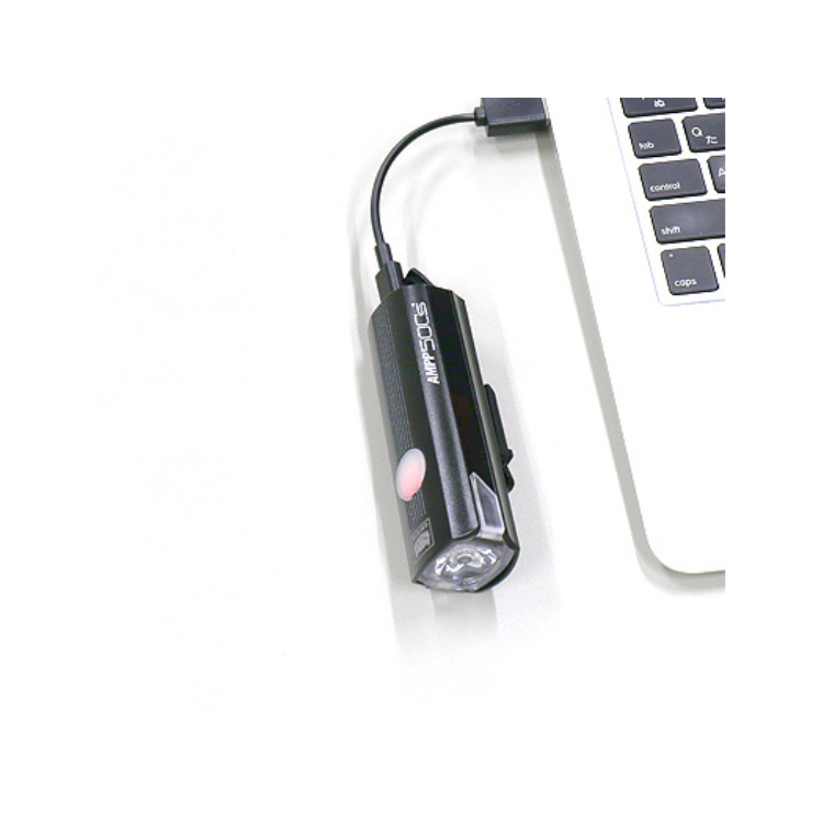 Cateye 500s AMPP 50CS bike light connected to USB for charging, providing modern convenience.