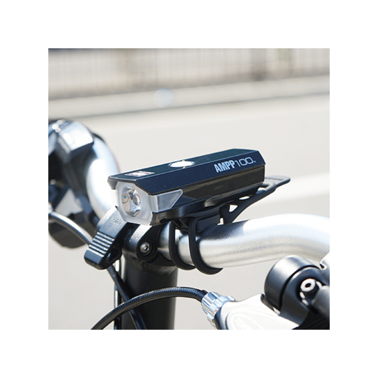 Cateye AMPP 100 front bike light being charged via USB, ensuring reliable power for every ride