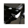 Cateye AMPP 100 front bike light mounted on handlebars, offering optimal brightness in an outdoor setting.