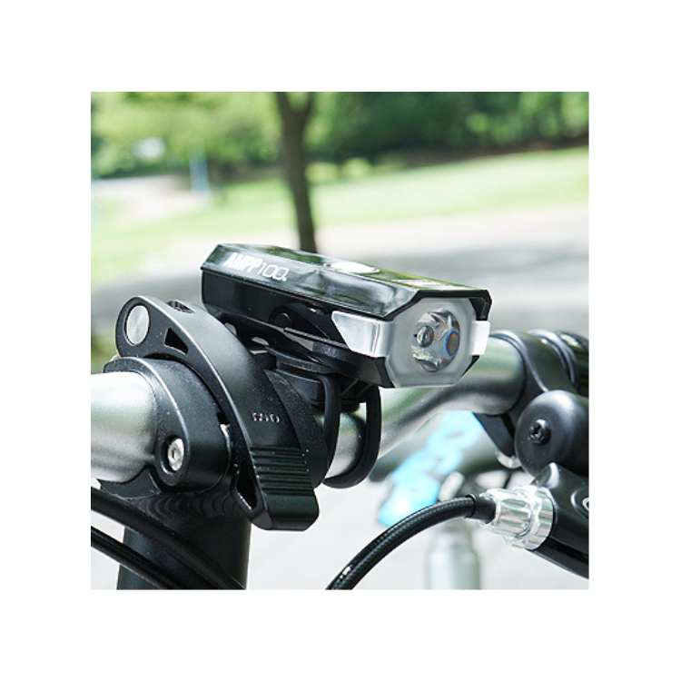 Cateye AMPP 100 front bike light in action, ensuring safe and bright visibility for cyclists.