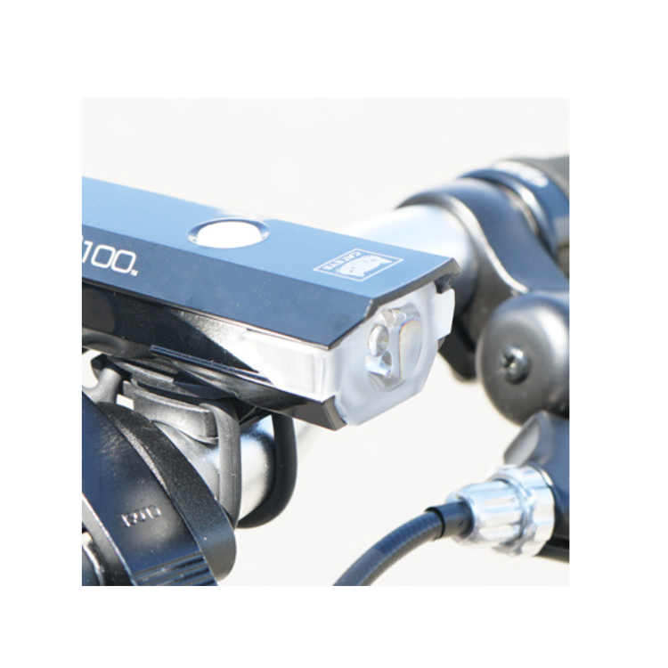 Cateye AMPP 100 front bike light with a wide beam for improved visibility in low-light conditions.