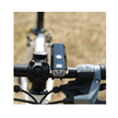 Close-up of Cateye AMPP 200 front bike light showing the power button and lens.