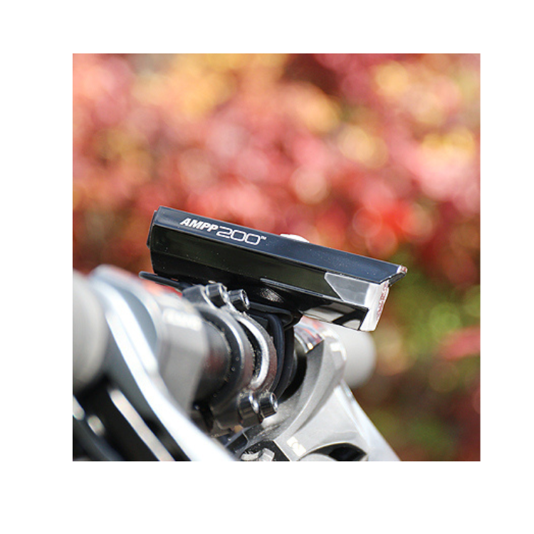Cateye AMPP 200 front bike light with wide beam illumination, ensuring clear visibility for cyclists.
