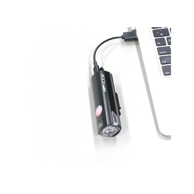 Cateye AMPP 400s front bike light being charged via USB, offering fast and convenient recharging.