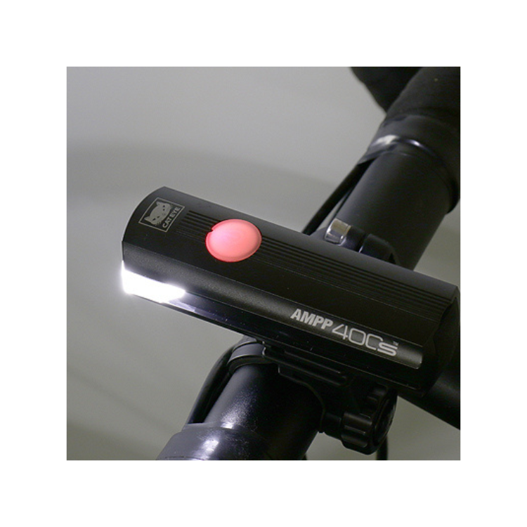 Close-up of Cateye AMPP 400s front bike light, showcasing the large power button for easy operation