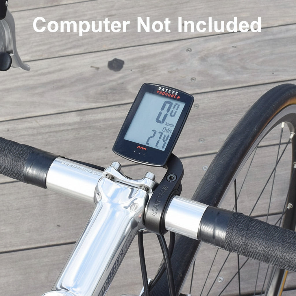 Bicycle speedometer attached to a bike handlebar on a wooden surface