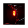 Cateye VIZ300 rear light emitting bright red light for enhanced visibility in dark conditions.