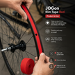 Red JOGOn rim tape being applied to a bicycle wheel with product details on a dark background.