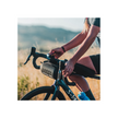 Lezyne Classic Drive 700XL front light mounted on bike handlebar, with a cyclist using a Lezyne handlebar bag while riding through a scenic outdoor route.