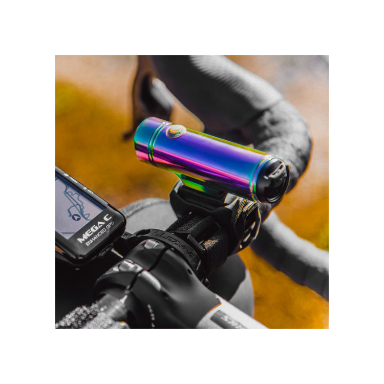 Lezyne Classic Drive 700XL front bike light in rainbow finish, mounted on the handlebar, offering a vibrant design and powerful LED light.