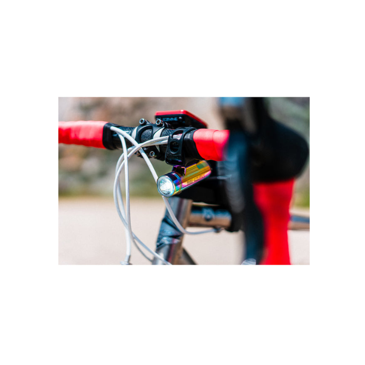 Lezyne Classic Drive 700XL front bike light in rainbow finish, mounted on the bike handlebar for enhanced visibility during cycling.