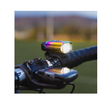 Lezyne Hecto Drive 500XL front bike light in rainbow finish, mounted on the handlebar with a bright LED for enhanced night visibility.