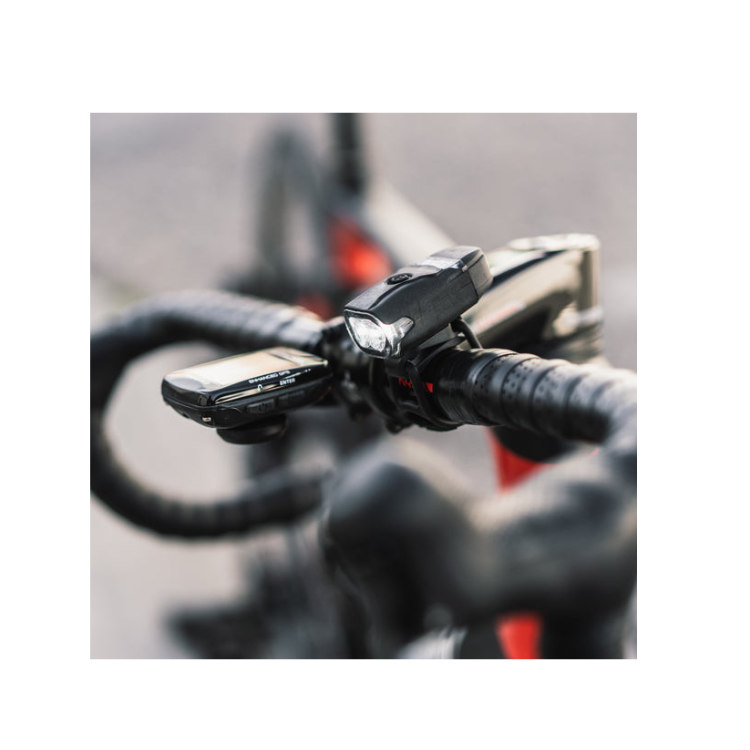 Lezyne LED front bike light mounted on the handlebar, providing maximum visibility for cyclists with a sleek and compact design.
