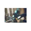 Lezyne Micro Drive 600XL front bike light mounted on the handlebar, showcasing bright LED light for enhanced cycling visibility.